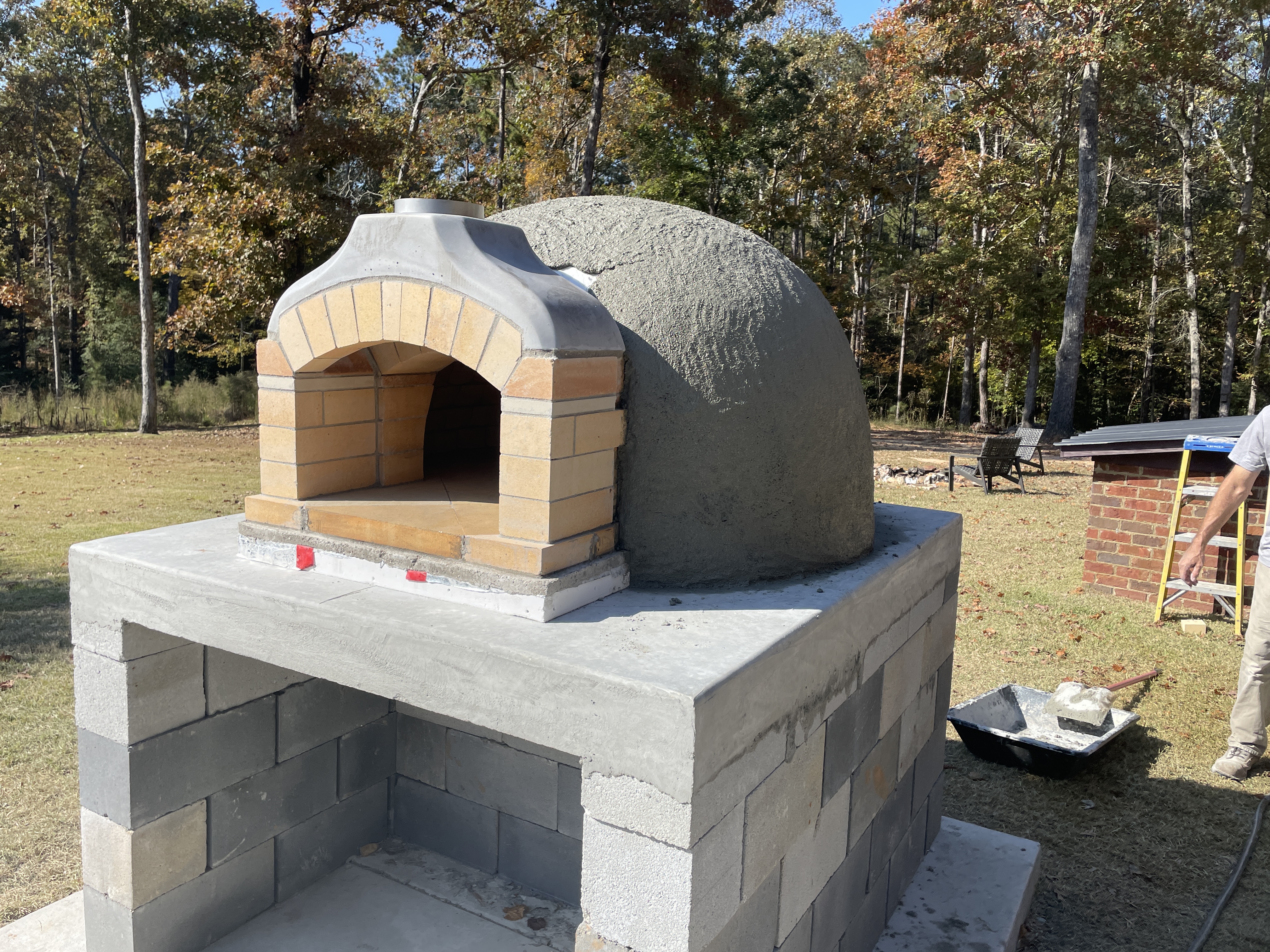 Custom outdoor wood-fired pizza oven under construction in South Carolina