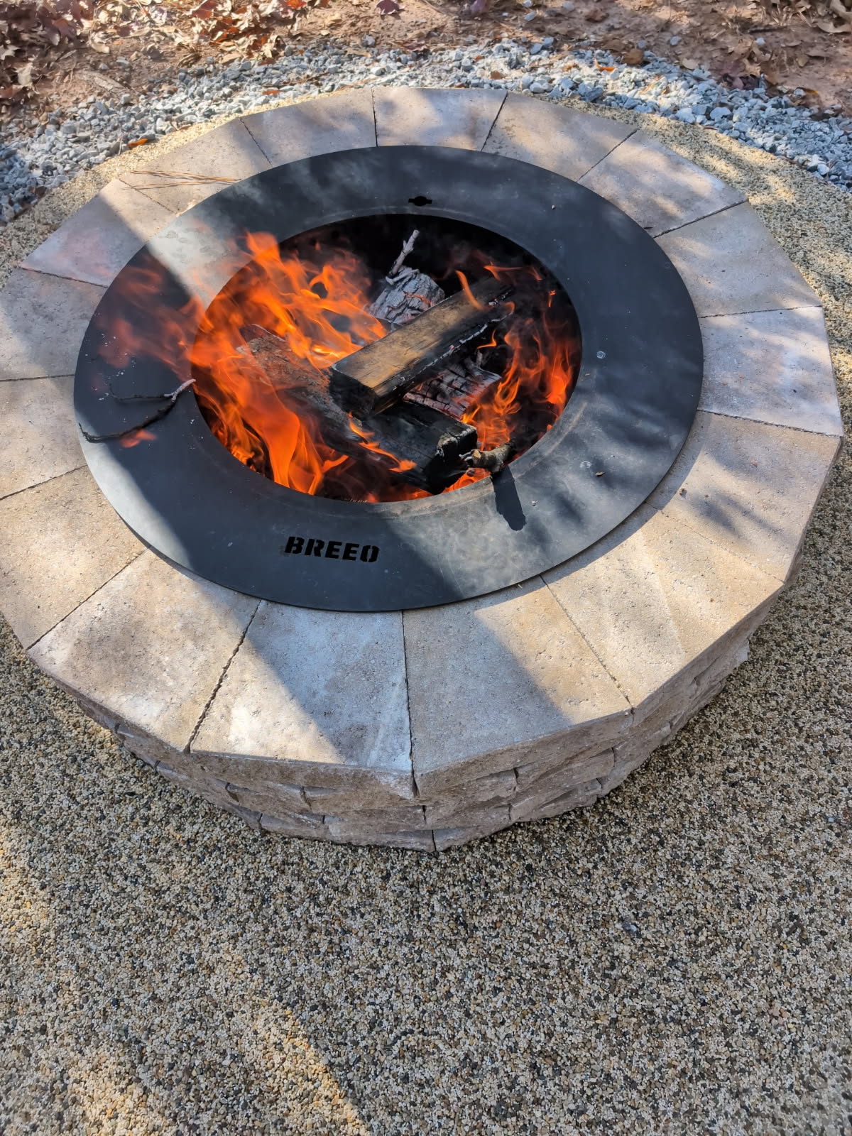 Breeo fire pit insert in stone fire pit
