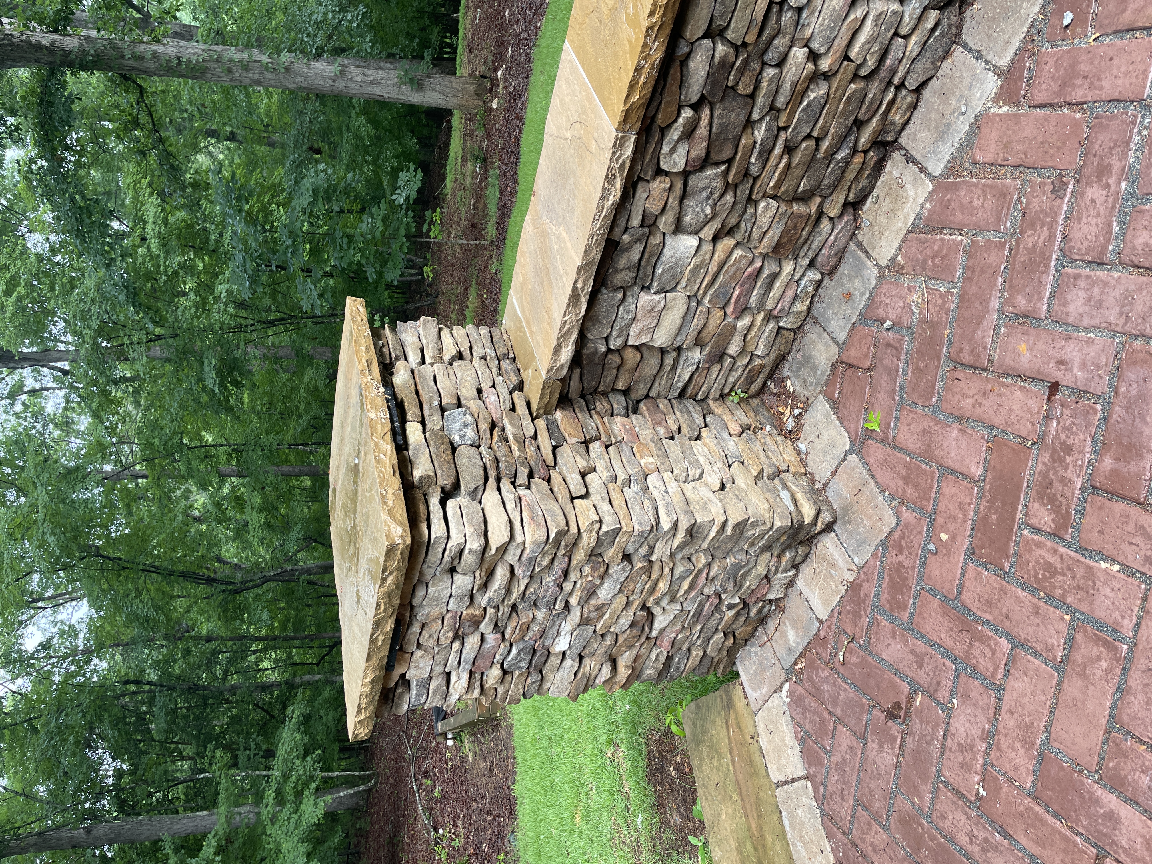 Custom stone column and retaining wall